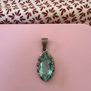 Elegant Silver Pendant with Aqua Gemstone